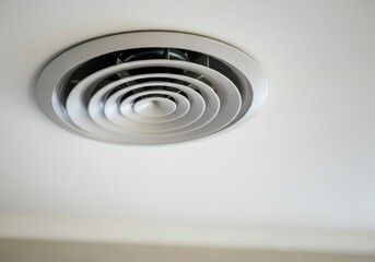 Obraz premium Modern circular air vent providing ventilation in a residential or commercial building