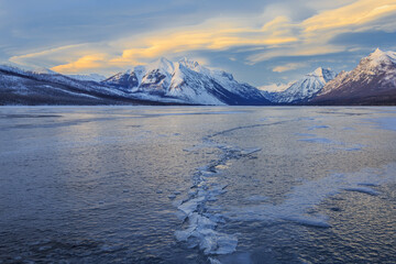 Frozen Lake And Snow Covered Mountains