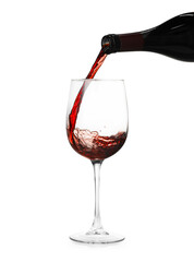 Pouring wine into glass on white background