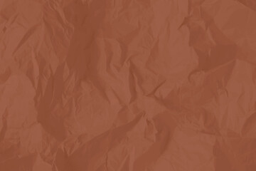 Crumpled paper Mocha Mousse color of the year 2025. Texture crumpled paper for your design. Copy space. Mocha Mousse color paper.