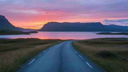 The empty road leading to the lake by sunset