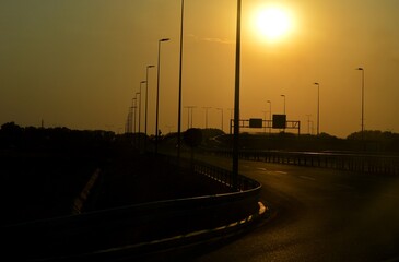 sunset on the road and bridge