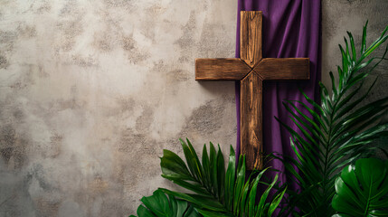 Wooden cross with palm leaves and purple fabric on textured wall, representing holy week celebration. 