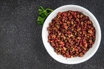 Sichuan pepper spice pepper peas fresh tasty food gourmet food background on the table rustic food top view copy space