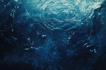 Textured Surface of Deep Blue Water with Soft Ripples and Bubbles, Perfect for Artistic Backgrounds