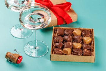A glasses of champagne elegantly paired with a box of rich chocolates