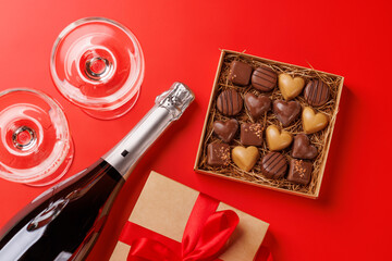 A glasses of champagne elegantly paired with a box of rich chocolates