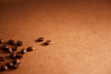 Close-up of Roasted Coffee Beans on a Brown Surface