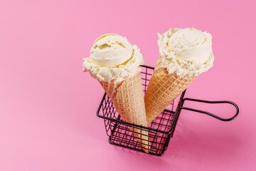 A refreshing ice cream cones set against a vibrant pink background