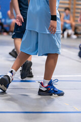 legs of basketball players during a match