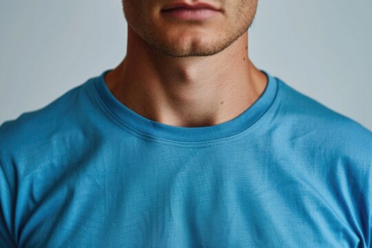 A professional man dressed in a blue shirt and tie, ready for business or formal occasion