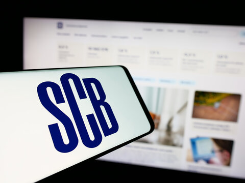 Stuttgart, Germany - 11-24-2024: Cellphone with logo of Statistiska Centralbyran (Statistics Sweden, SCB) on screen in front of website. Focus on center-left of phone display.
