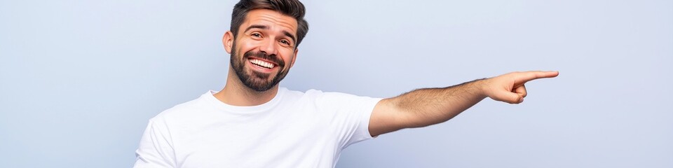 Obraz premium A man with a beard is pointing to the right. He is smiling and he is happy