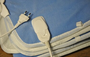 folded electric blanket close-up. the concept of warmth and comfort in the home at low temperatures