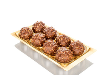 Several chocolate candies, close-up, isolated on a white background.