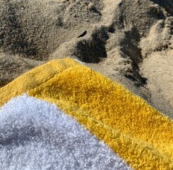 Vibrant Yellow Beach Towel on Sand