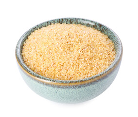 Raw wheat groats in bowl isolated on white