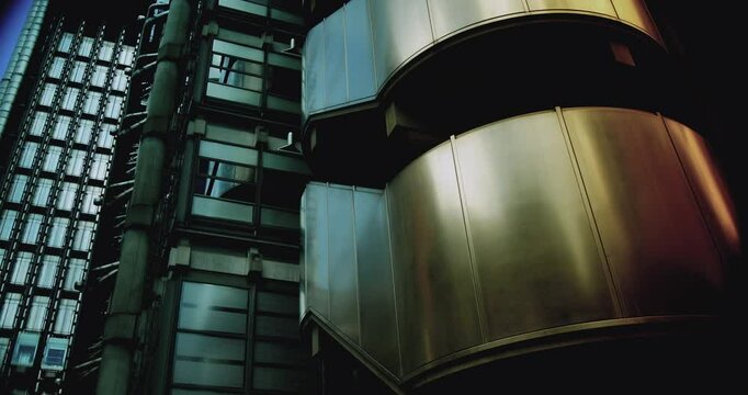 The stainless steel facade and many exterior elevators give a science fiction air to London, time lapse.