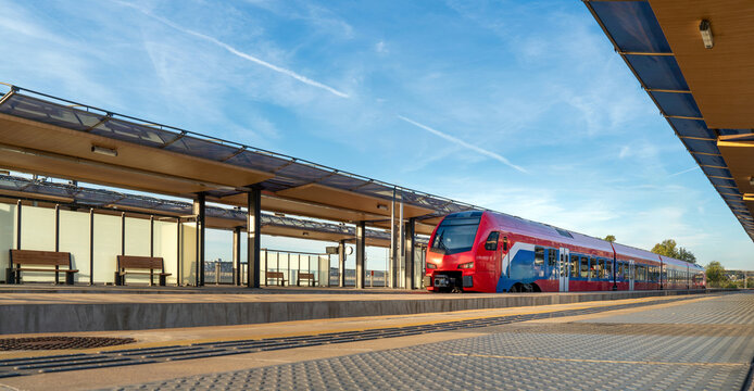 Zero emission train at railroad platform in the station.