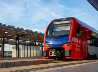 Zero emission train at railroad platform in the station.