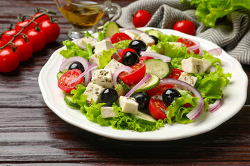 Delicious salad with feta cheese on wooden table, closeup