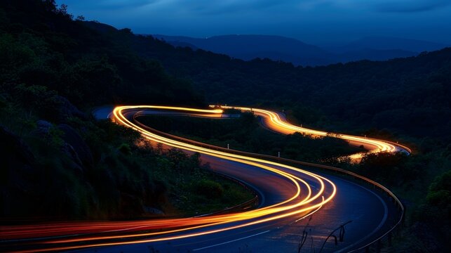The mountain roads are a conduit of energy cars zipping through the curves leaving behind a trail of fierce white light.
