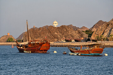 Muscat, Oman. Traditional ships Dhow in the lagoon. Travel and summer tourism in Arab countries