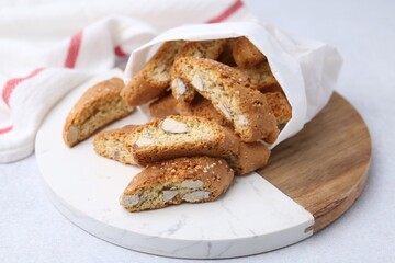 Traditional Italian almond biscuits (Cantucci) on light table, closeup
