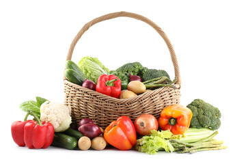 Different ripe vegetables in basket isolated on white