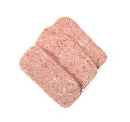 Pieces of canned meat isolated on white, top view