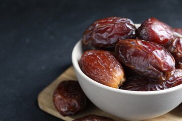 Tasty dried dates on grey table, closeup. Space for text