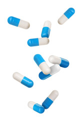 Antibiotic pills in air on white background