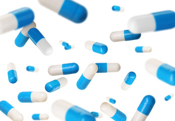 Antibiotic pills in air on white background