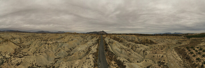 Aerial view of the road crossing the Abanilla desert or Mahoya desert in Murcia, Spain