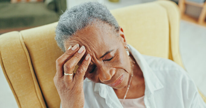 Sad, senior and thinking with black woman on sofa for reflection, depression and retirement. Dementia, memory and regret with elderly person in living room of nursing home for grief, lonely and tired