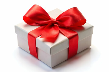 Obraz premium A beautifully wrapped gift box with a vibrant red ribbon, perfect for celebrations and special occasions.