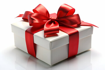 Obraz premium A beautifully wrapped white gift box with a glossy red ribbon and bow, perfect for any celebration or occasion.