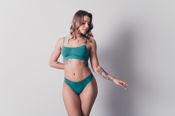 Naklejka premium No filter studio photo of slender cute woman underwear enjoying self acceptance isolated white color background