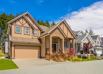 Two story stucco luxury house with nice summer  landscape in Vancouver, Canada, North America. Day...