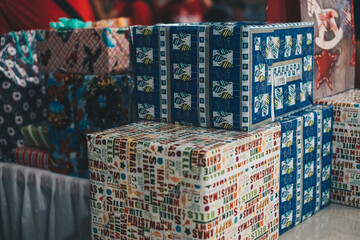 Several Christmas gift boxes in various sizes, colors and designs. Selective focus. Copy space.