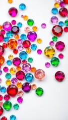 A vibrant array of colorful gems scattered on a smooth white background, assortment