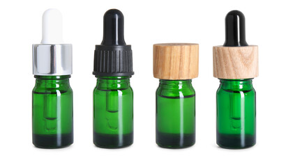 Essential oils in different bottles on white background