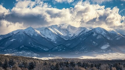 Snow-Covered Mountain Range Under Cloudy Monochromatic Sky