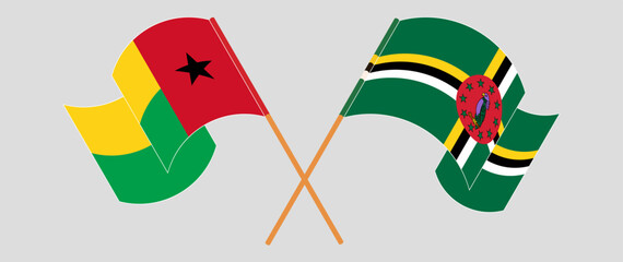 Crossed and waving flags of Guinea-Bissau and Dominica. Vector illustration