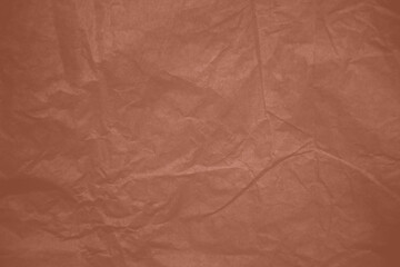 Crumpled paper Mocha Mousse color of the year 2025. Texture crumpled paper for your design. Copy space. Mocha Mousse color paper.