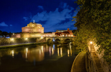 Fototapeta premium Ponte Sant'Angelo leads to Castel Sant’Angelo, also known as the Mausoleum of the Roman Emperor Hadrian, a fortress located on the right bank of the Tiber River, a short distance from Vatican City.