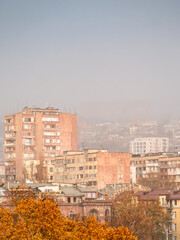 Naklejka premium pink air in rain over apartment houses in autumn