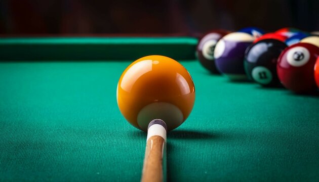 billiard table with balls and cue