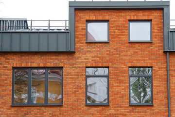 Construction, sale and rental of real estate. View of the new apartment building. The exterior of modern real estate.