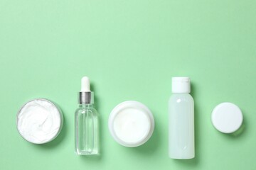 Natural cosmetic products on color background, top view